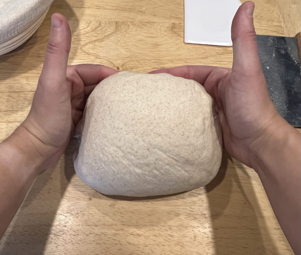 Tighten the seams by pulling the dough toward yourself