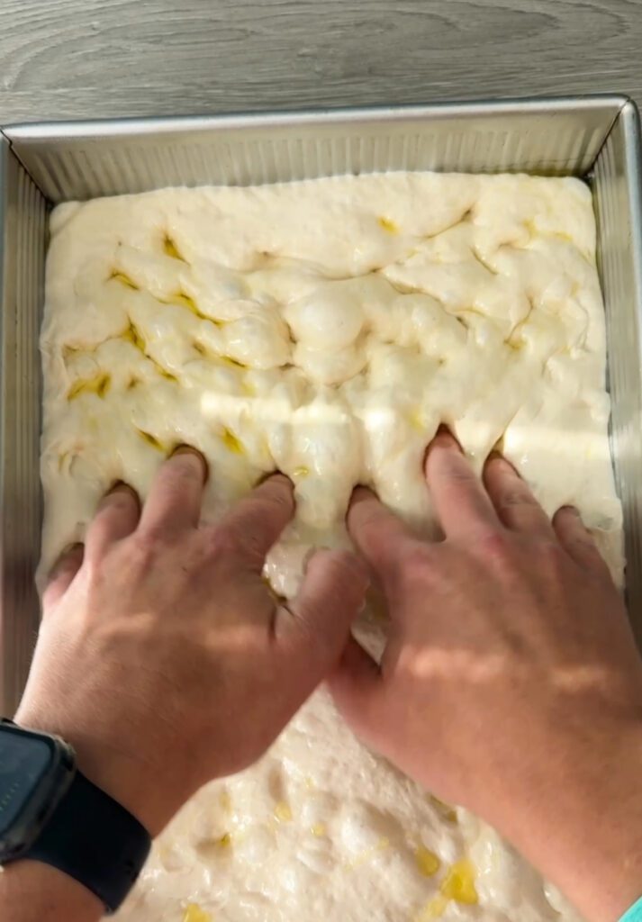dimpling sourdough focaccia