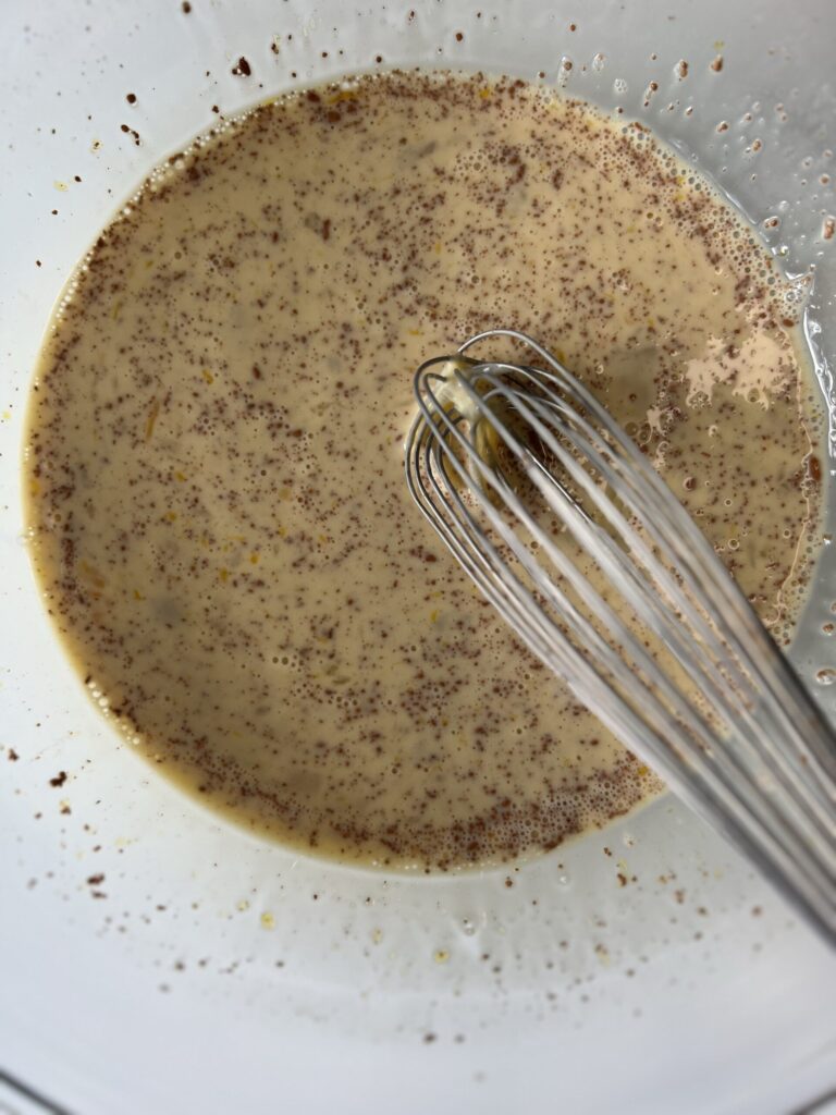 Align the bread in the dish, whisk together the ingredients, and pour over the bread