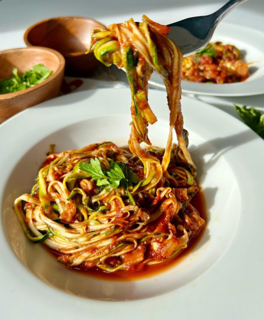 fork with sauce and zoodles