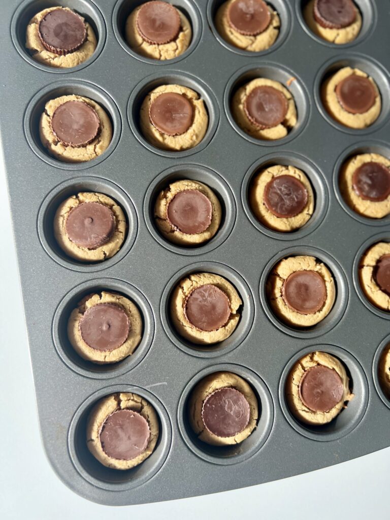 sourdough peanut butter cups in muffin tray