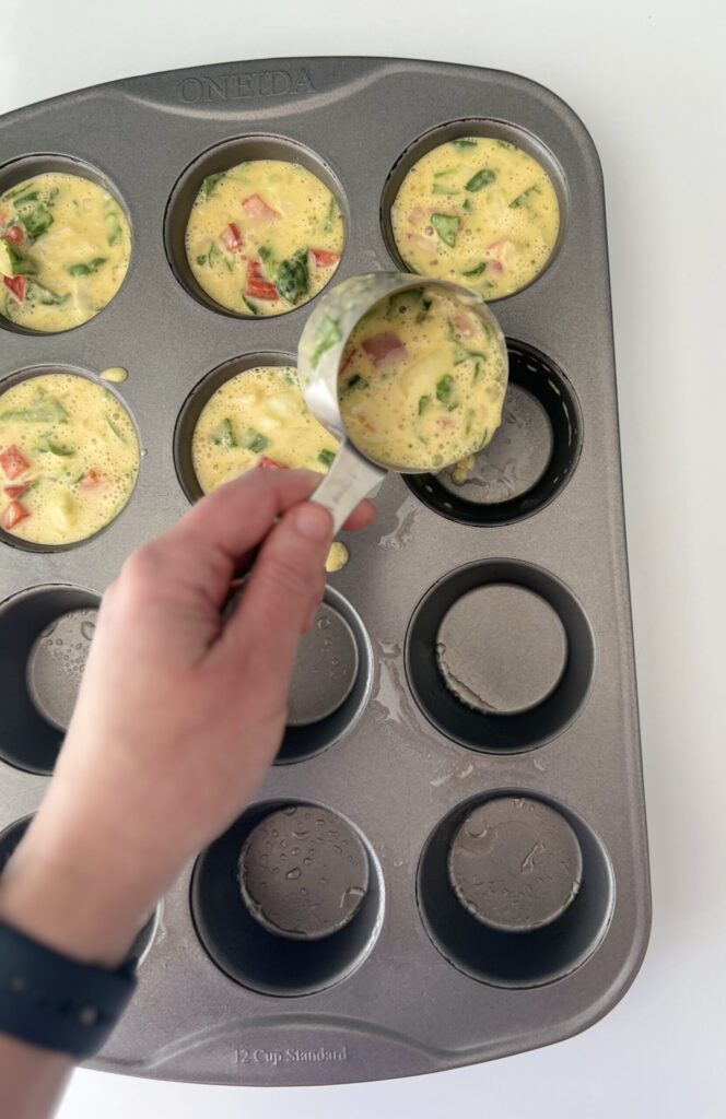 Pour 1/2 cup of the mixture into each muffin cup