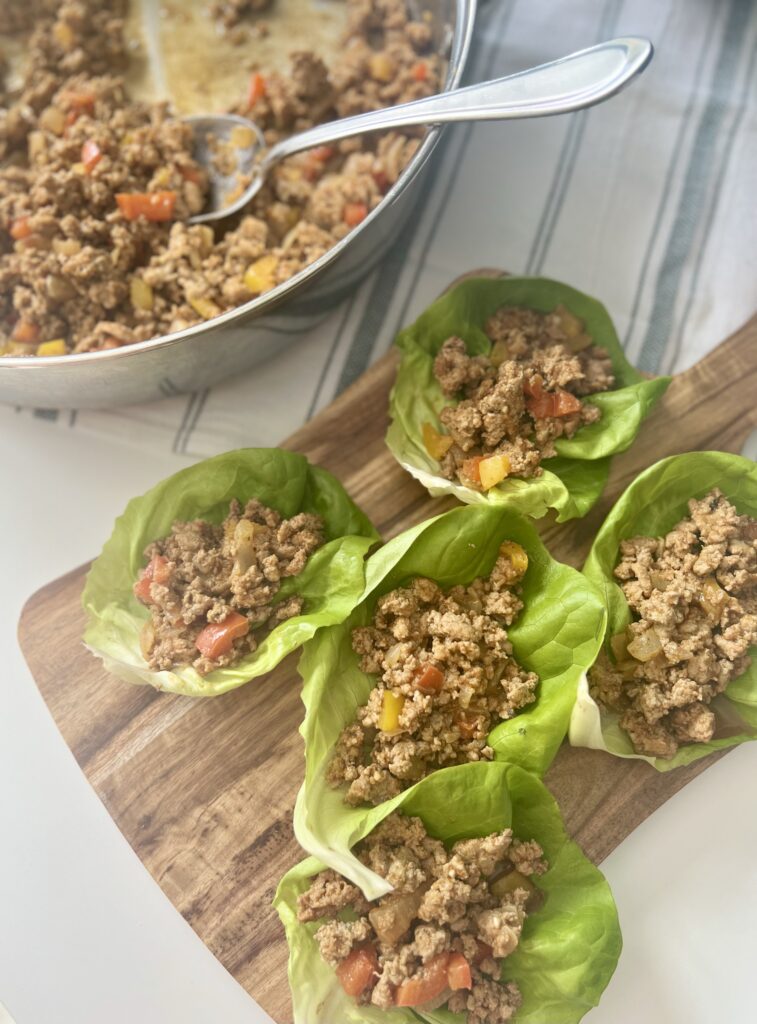 turkey taco lettuce boats - Brown the meat, allow it to simmer with the seasoning, and spoon the mixture into the lettuce leaves