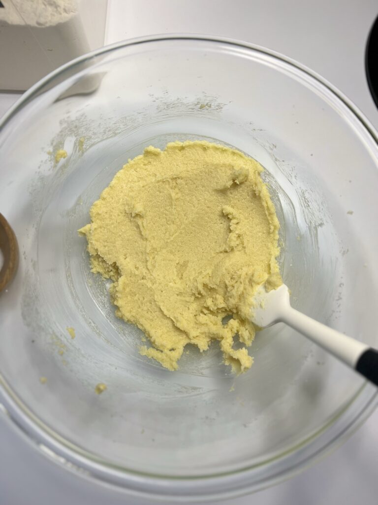 In a large mixing bowl cream together the softened butter and sugar until fluffy.  Next, add the sourdough starter, egg, vanilla extract, and maple syrup, and mix until everything is combined. 