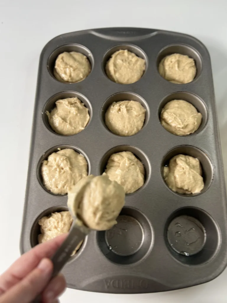 Scoop the batter into each muffin tin filling each cup about 3/4 of the way full. 