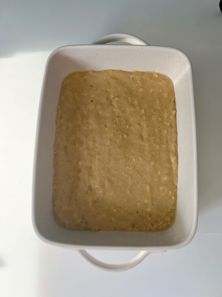 Pour the batter into the cake pan and spread evenly. 