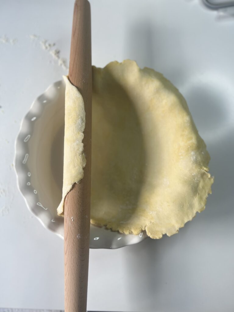 sourdough pie crust - Use your rolling pin to lift the pie crust into the pie dish and press the crust into the dish. 