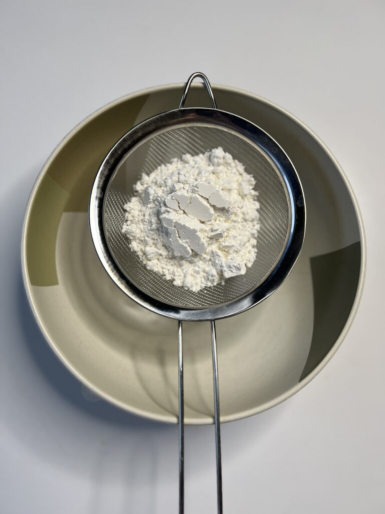 In a separate bowl, sift together the flour, baking powder, and salt and mix.