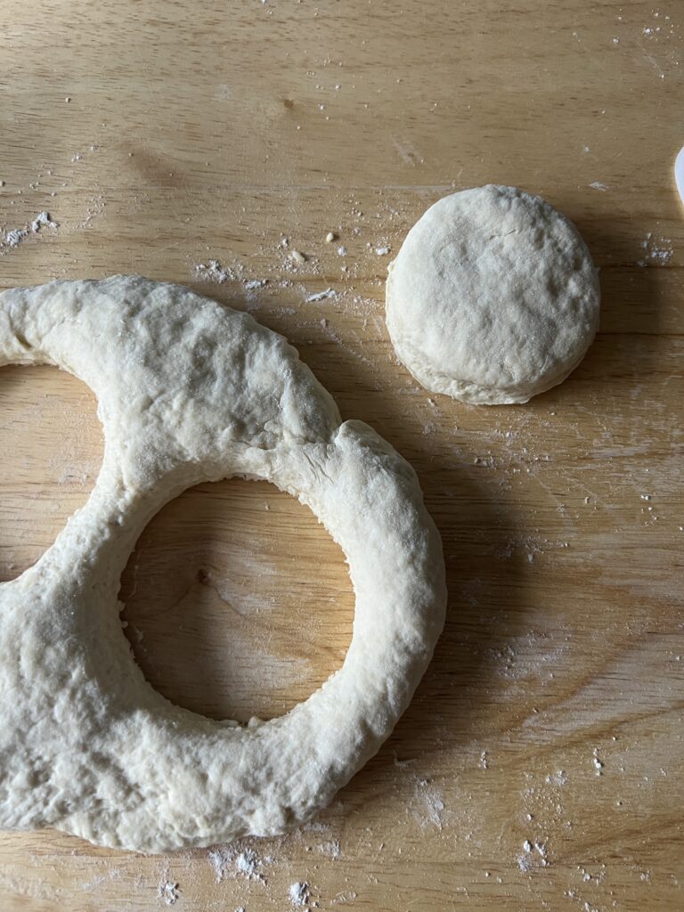 cutting out the biscuit dough