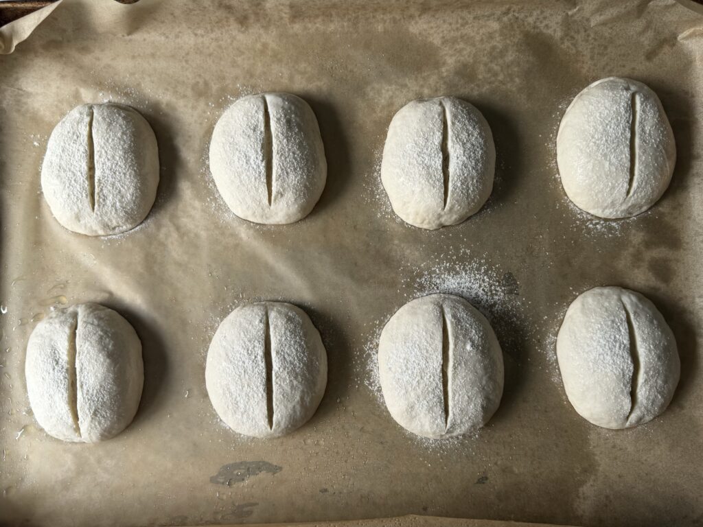 scored sourdough crusty rolls