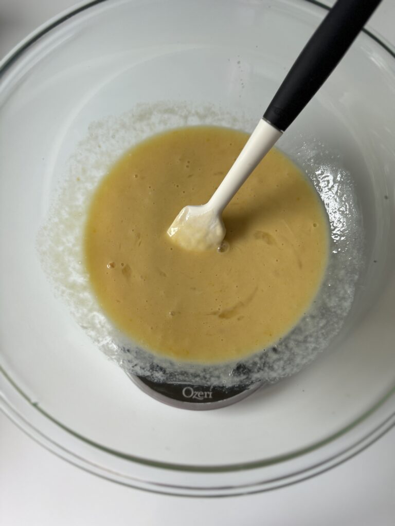 adding in the eggs to sourdough brioche