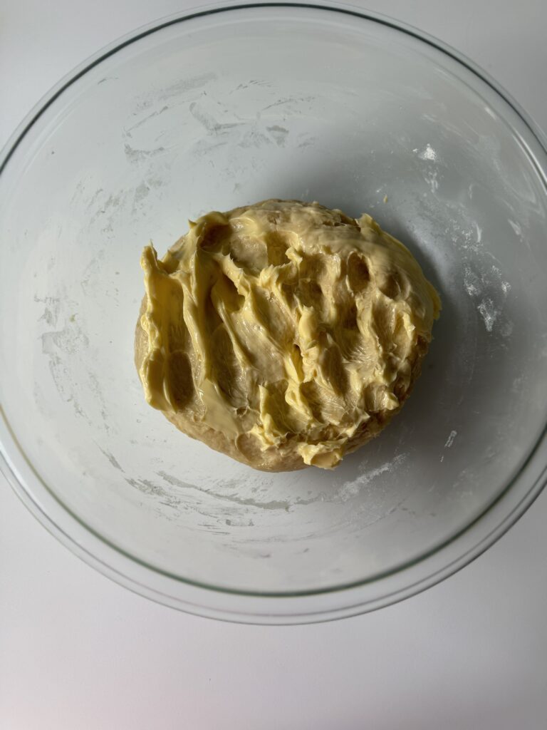 kneading butter into sourdough brioche