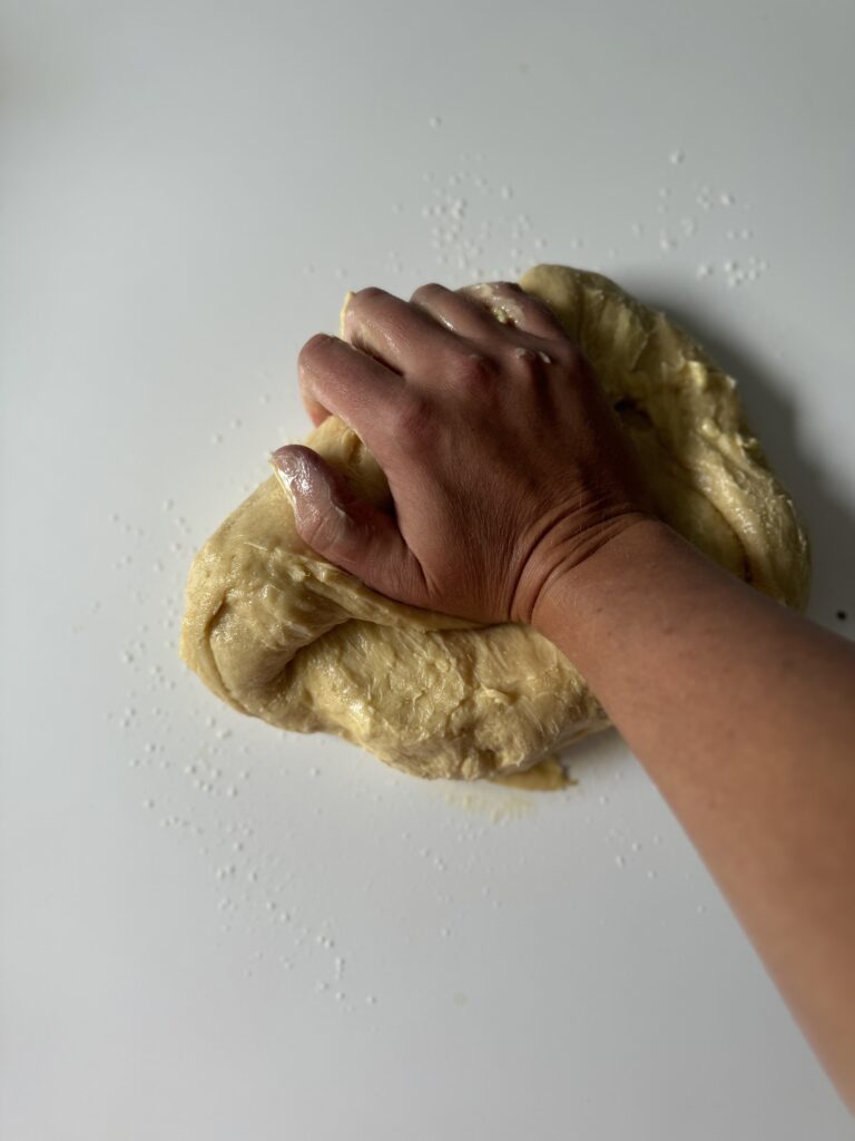 kneading sourdough brioche dough