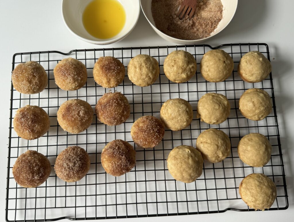 dipping sourdough donut muffins in mixture