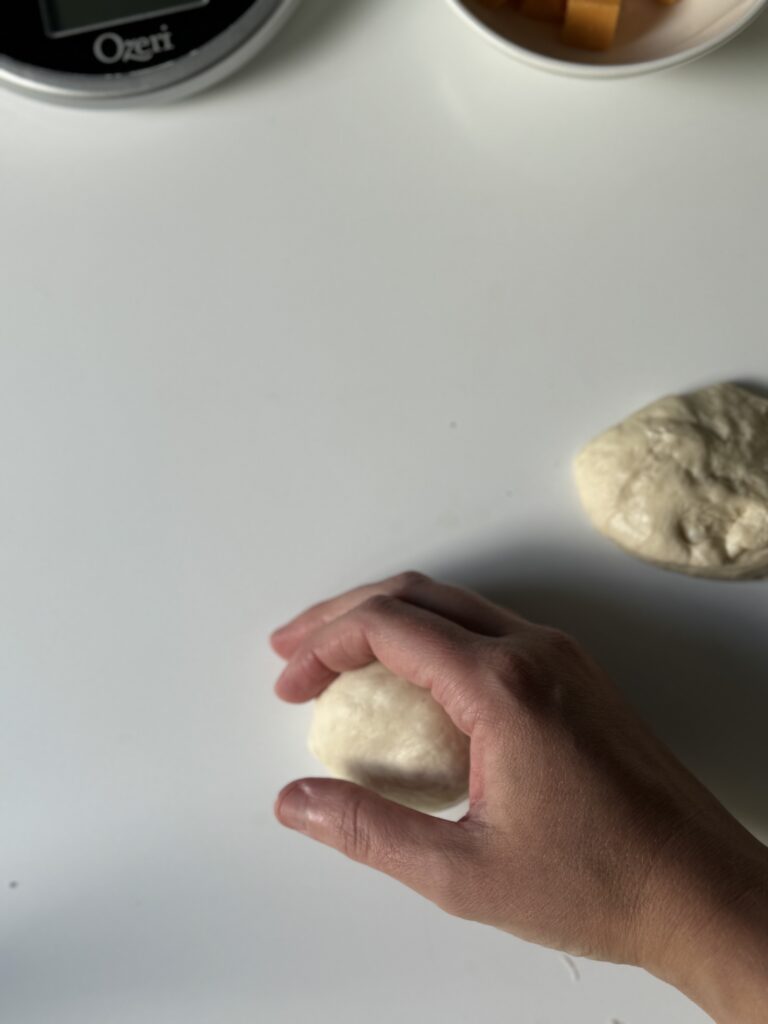 smoothing the dough ball out