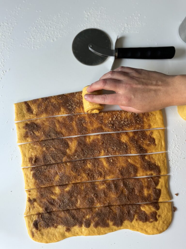 shaping cinnamon rolls