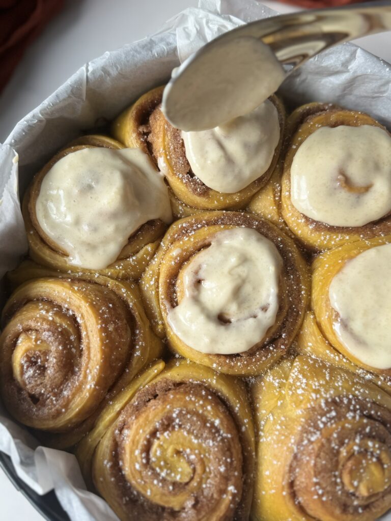 frosting sourdough pumpkin cinnamon rolls