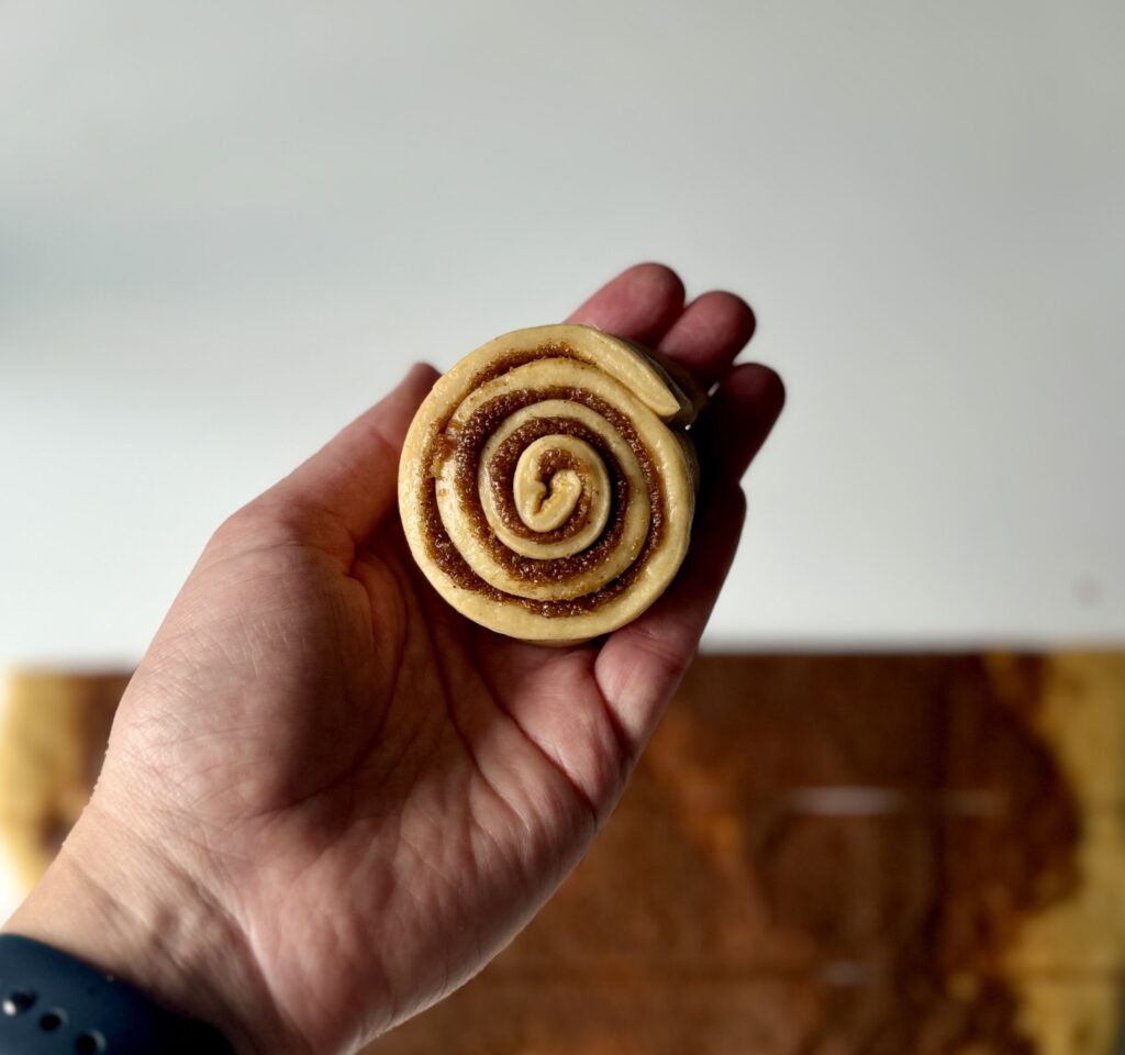 shaping gingerbread cinnamon rolls