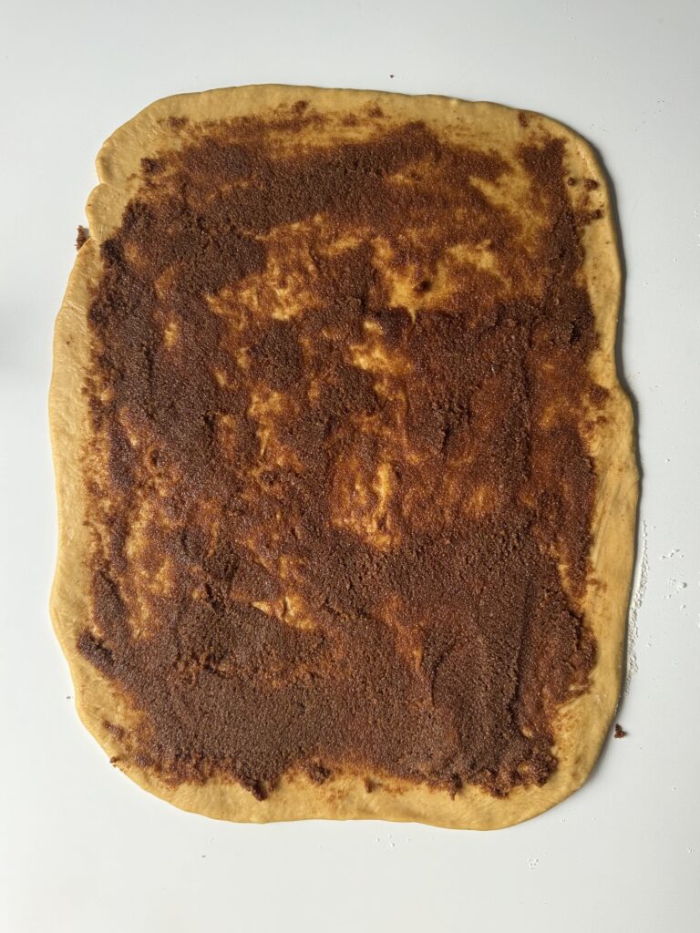 shaping gingerbread cinnamon rolls