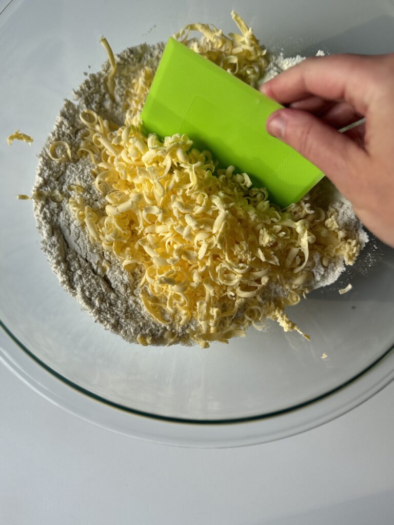 cutting the butter into the dry mixture