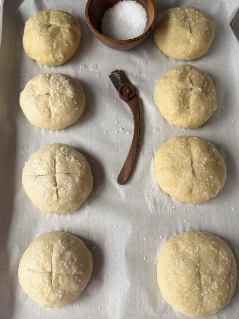 scoring and salting pretzel buns