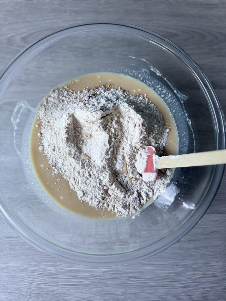 mixing applesauce cake