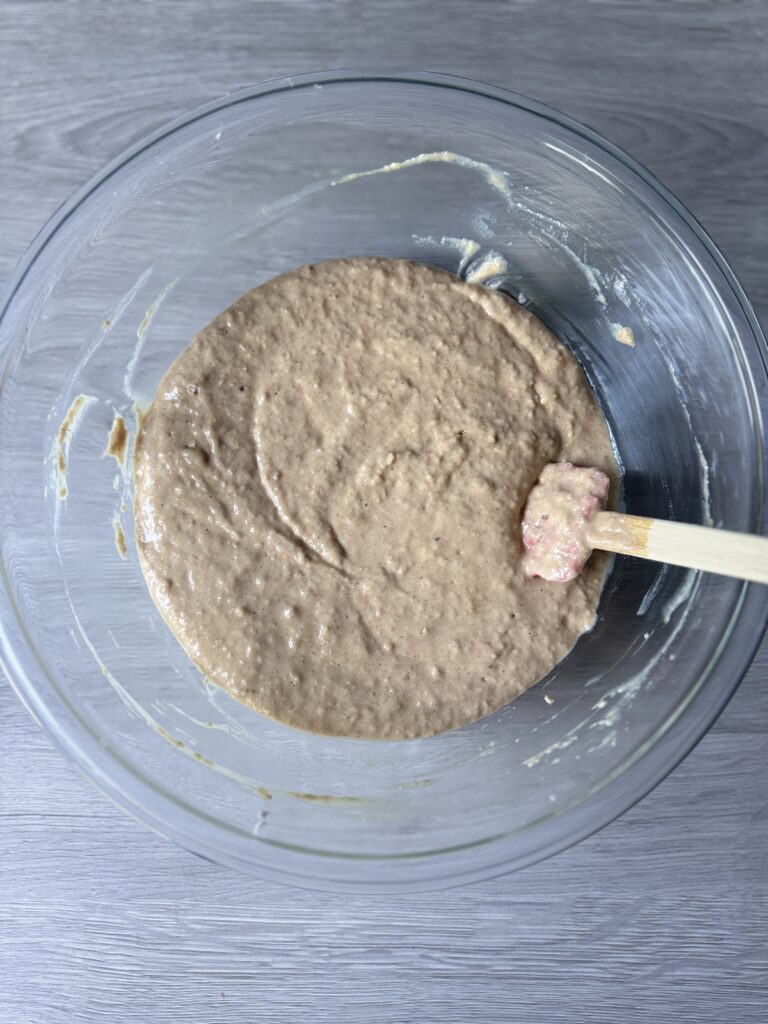 mixing applesauce cake
