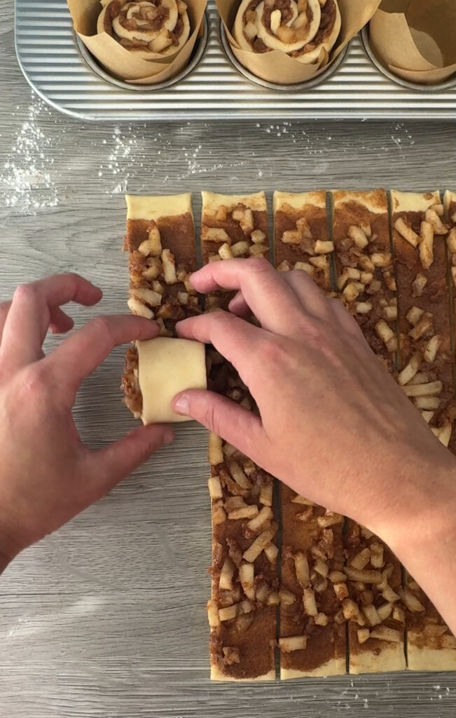 rolling the apple cinnamon rolls