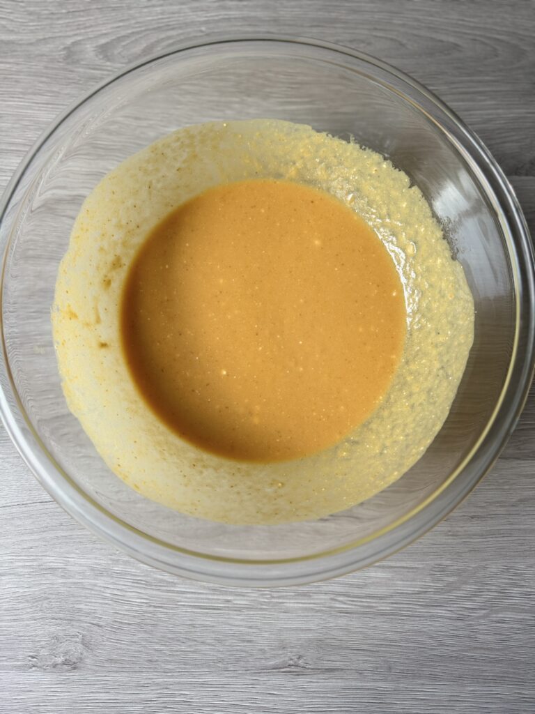 mixing pumpkin donut muffins