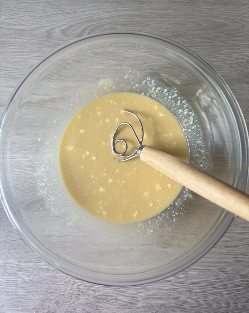 mixing apple cider donut muffins