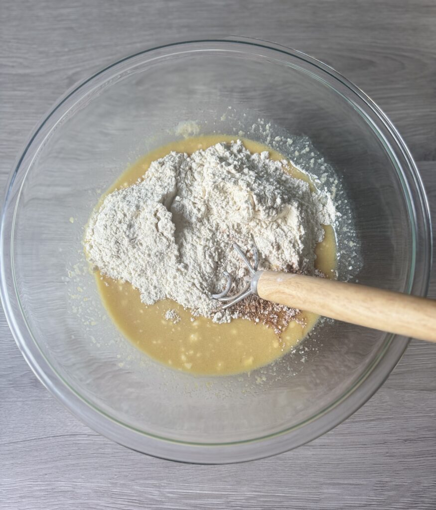mixing apple cider donut muffins