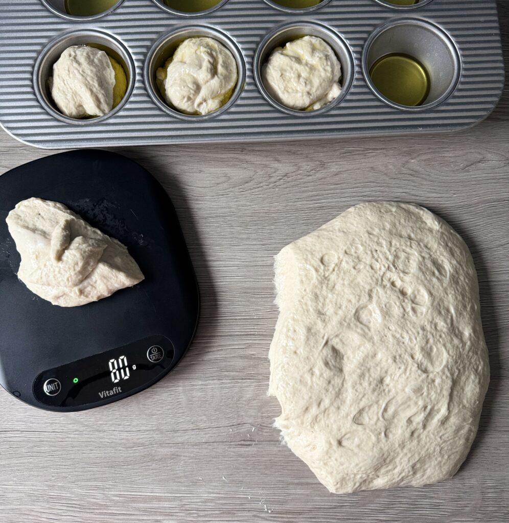 shaping cranberry bri focaccia muffins