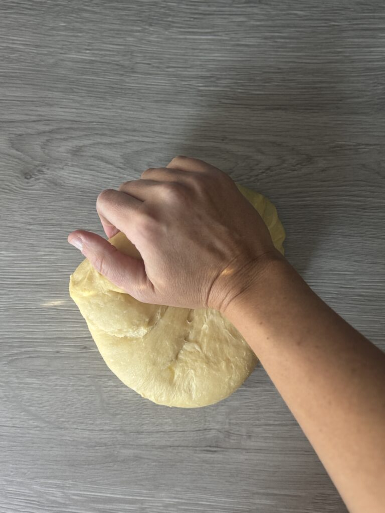 kneading donut dough