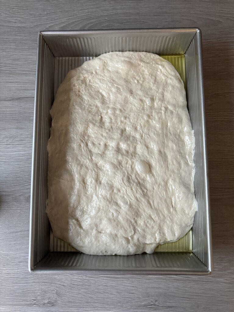 shaping sourdough focaccia
