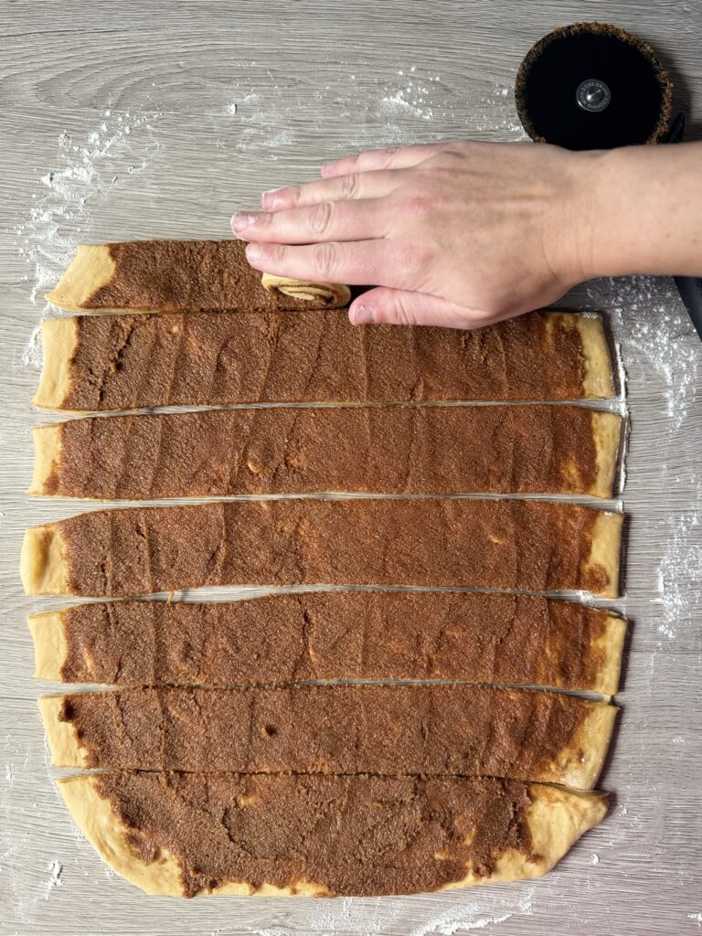rolling gingerbread sourdough cinnamon rolls
