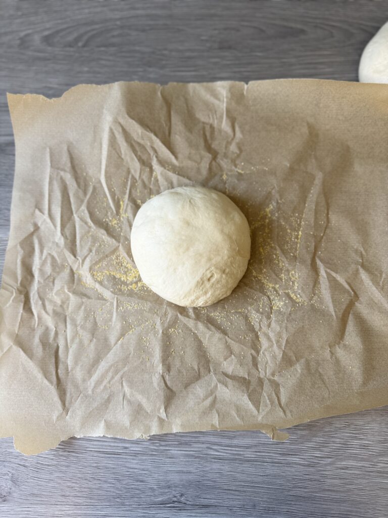 place the dough ball on parchment