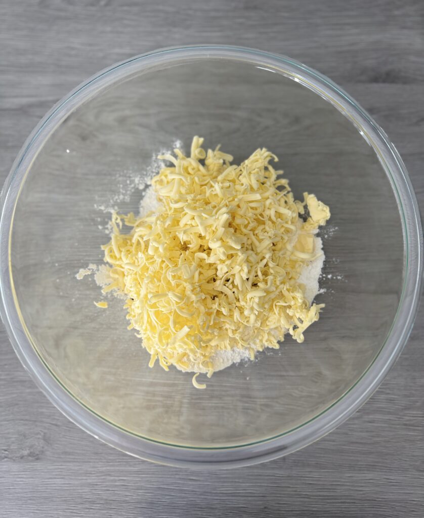 mixing everything bagel biscuit bombs