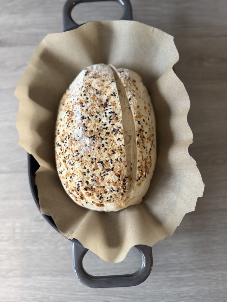 everything bagel sourdough bread in the baking pan
