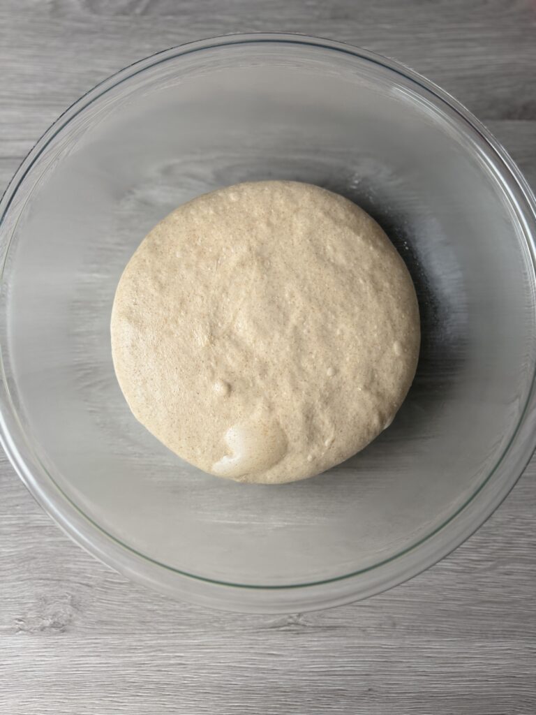 proofed honey wheat sourdough sandwich bread