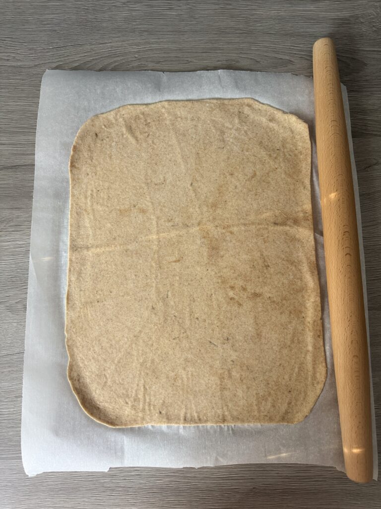 rolling cracker dough out