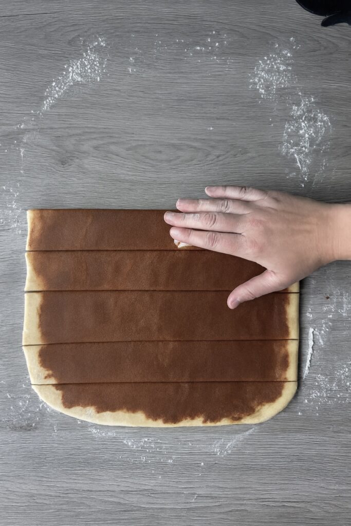 shaping cinnamon rolls