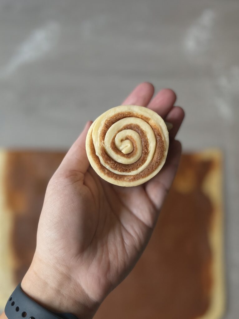 shaping cinnamon rolls