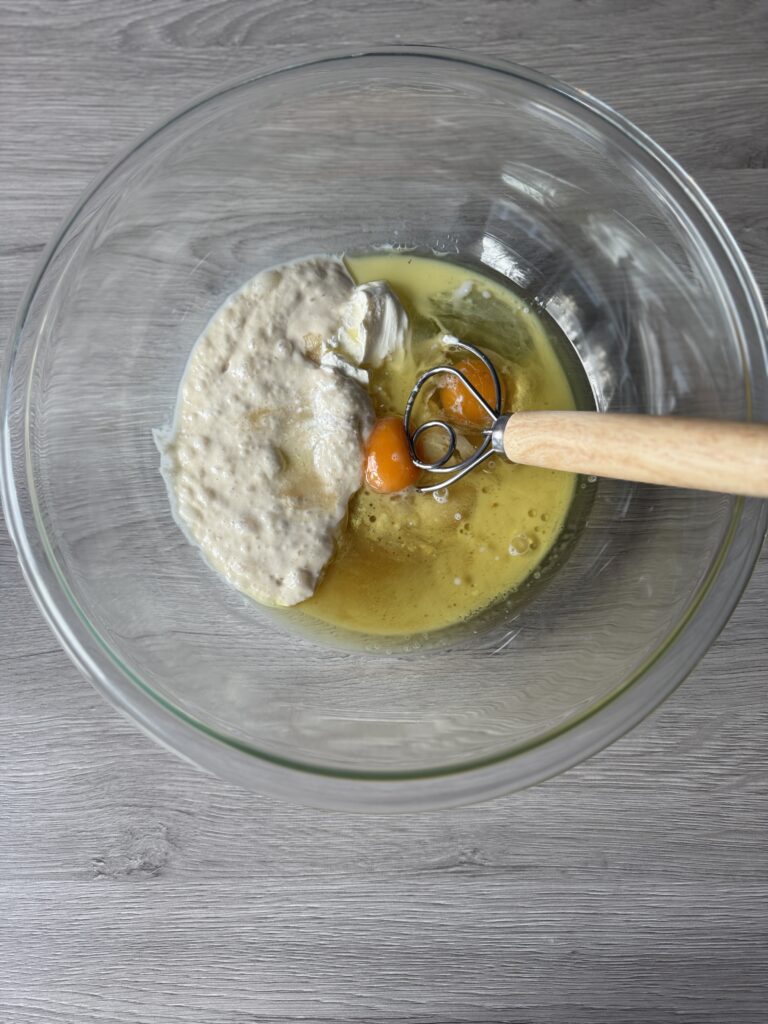 mixing blueberry bread