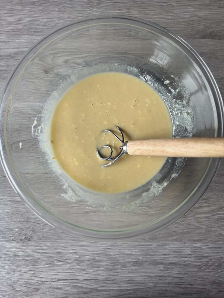 mixing blueberry bread