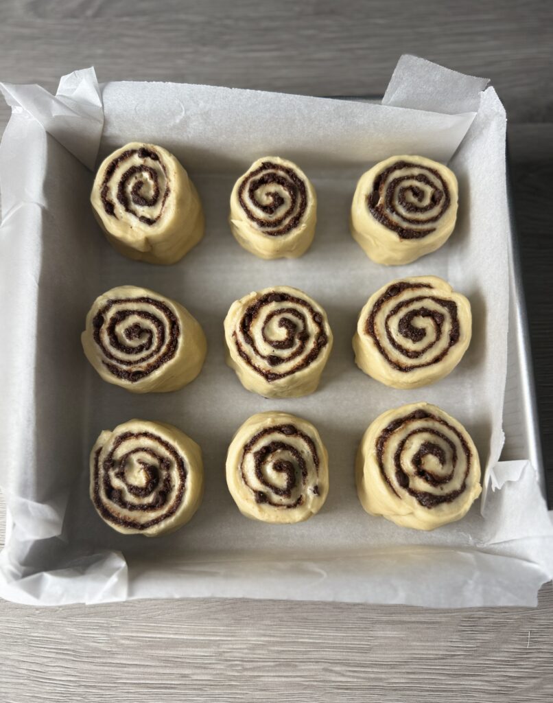 shaped cinnamon rolls in pan