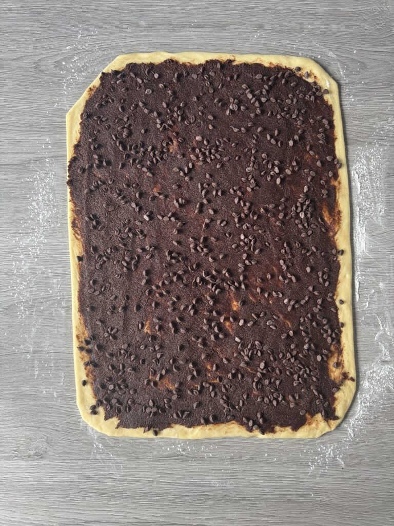 spreading filling over the dough