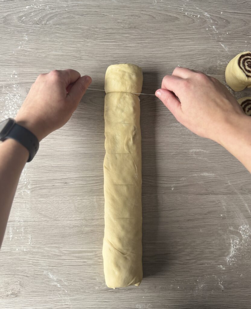 cutting sourdough cinnamon rolls