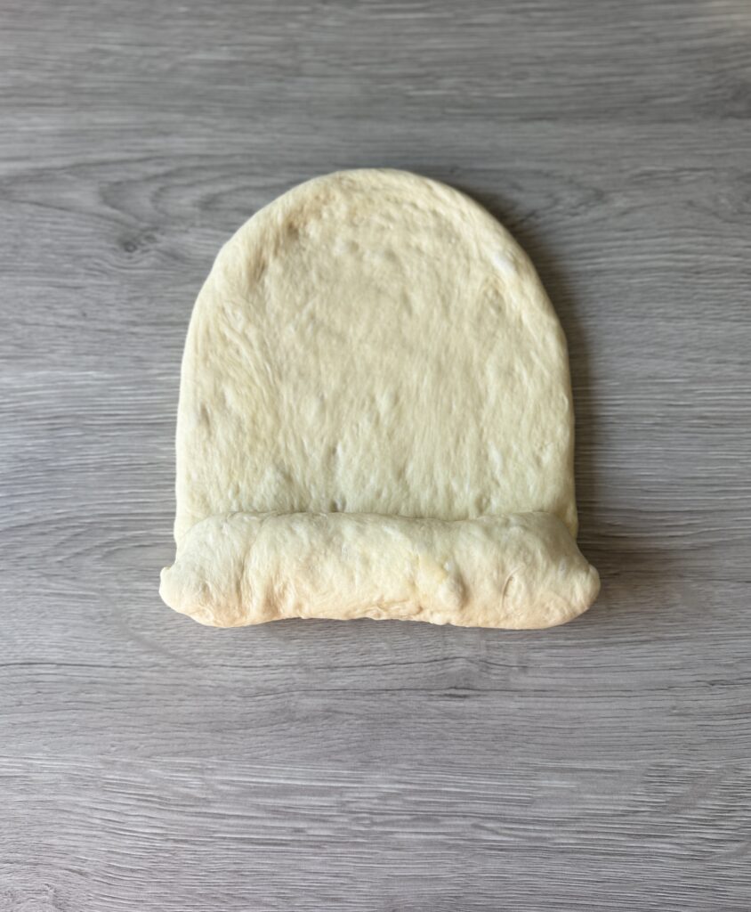 shaping sourdough discard French bread