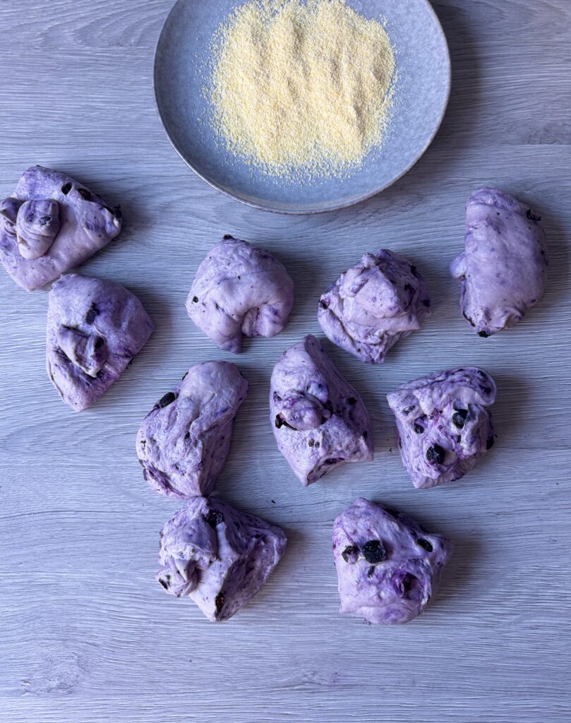 shaping blueberry English muffins