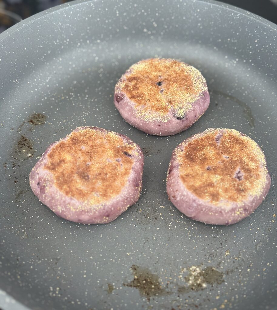 frying blueberry English muffins